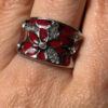 A beautiful ring with enamel and red flowers, size Q.