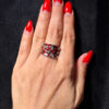 A beautiful ring with enamel and red flowers, size Q.