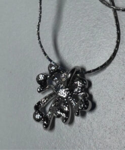 Silver-colored pendant with blue stones on a chain