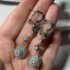 Silver-colored earrings