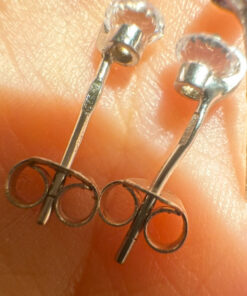 Two pairs of silver stud earrings