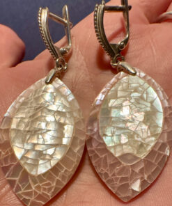 Silver earrings with a mother-of-pearl mosaic, shimmering in pink, white, and blue tones.