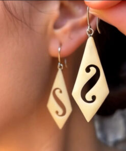 Vintage carved bone dangle earrings in a diamond shape.