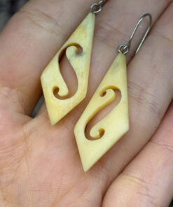 Vintage carved bone dangle earrings in a diamond shape