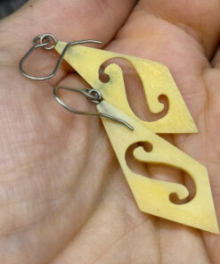 Vintage carved bone dangle earrings in a diamond shape