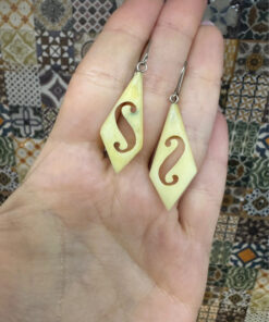 Vintage carved bone dangle earrings in a diamond shape.