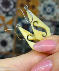 Vintage carved bone dangle earrings in a diamond shape