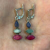 Stunning silver earrings with natural emerald, ruby, and sapphire.