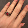 Vintage early 20th-century nickel ring, size L, with a red stone.