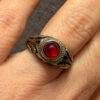 Vintage early 20th-century nickel ring, size L, with a red stone.