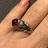Vintage early 20th-century nickel ring, size L, with a red stone.