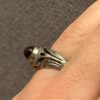 Vintage early 20th-century nickel ring, size L, with a red stone.