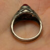 Vintage early 20th-century nickel ring, size L, with a red stone.