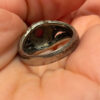 Vintage early 20th-century nickel ring, size L, with a red stone.