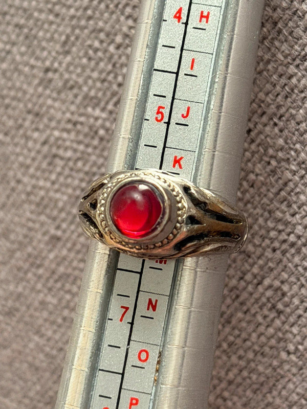 Vintage early 20th-century nickel ring, size L, with a red stone.