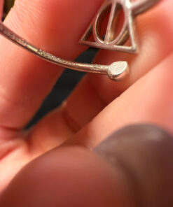 A symbolic ring made of 925 sterling silver, adjustable size, approximate size L