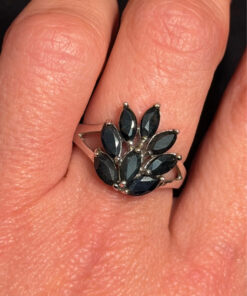 A stunning silver ring with deep blue natural sapphires, size N