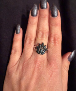 A stunning silver ring with deep blue natural sapphires, size N