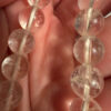 Earrings with large cubic zirconia stones and a natural rock crystal bracelet