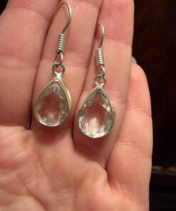Earrings with large cubic zirconia stones and a natural rock crystal bracelet