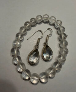 Earrings with large cubic zirconia stones and a natural rock crystal bracelet