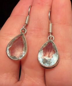 Earrings with large cubic zirconia stones and a natural rock crystal bracelet