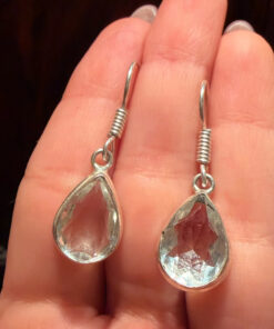 Earrings with large cubic zirconia stones and a natural rock crystal bracelet