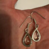 Earrings with large cubic zirconia stones and a natural rock crystal bracelet
