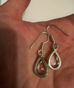 Earrings with large cubic zirconia stones and a natural rock crystal bracelet