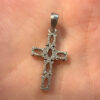 Oval cut natural Swiss blue topaz cross pendant in sterling silver