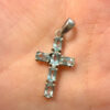 Oval cut natural Swiss blue topaz cross pendant in sterling silver