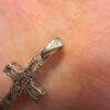Oval cut natural Swiss blue topaz cross pendant in sterling silver