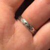 A sterling silver ring with natural charoite, size N 1/2