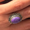 A sterling silver ring with natural charoite, size N 1/2