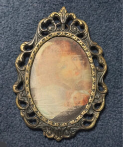 Vintage bronze decorative photo frame with silkscreened print.