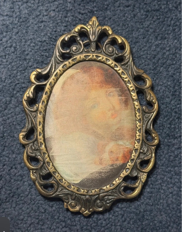 Vintage bronze decorative photo frame with silkscreened print.
