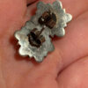 This is a pair of vintage sterling silver amethyst floral stud earrings.#121