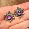 This is a pair of vintage sterling silver amethyst floral stud earrings.#121