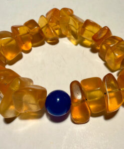 Ancient high-quality large amber bracelet with a chalcedony bead
