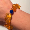 Ancient high-quality large amber bracelet with a chalcedony bead