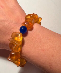 Ancient high-quality large amber bracelet with a chalcedony bead