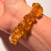 Ancient high-quality large amber bracelet with a chalcedony bead
