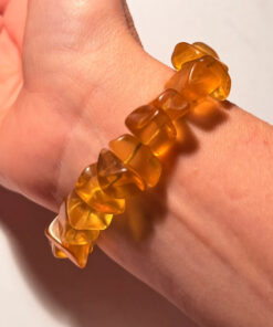 Ancient high-quality large amber bracelet with a chalcedony bead