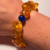 Ancient high-quality large amber bracelet with a chalcedony bead