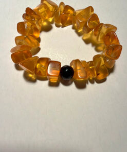 Ancient high-quality large amber bracelet with an onyx bead (for a slender wrist)