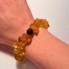 Ancient high-quality large amber bracelet with an onyx bead (for a slender wrist)