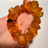 Ancient high-quality large amber bracelet with an onyx bead (for a slender wrist)