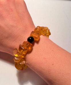 Ancient high-quality large amber bracelet with an onyx bead (for a slender wrist)