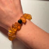 Ancient high-quality large amber bracelet with an onyx bead (for a slender wrist)