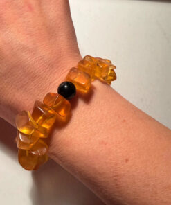 Ancient high-quality large amber bracelet with an onyx bead (for a slender wrist)